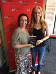 Image shows Rachel Amphlett with breakfast presenter Rebecca Levingston in the 612 ABC Brisbane radio studio