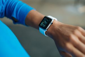 Person wearing a fitness tracker on their wrist