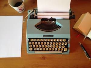 Typewriter and pages on desk