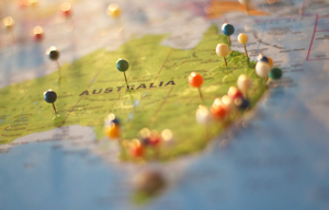 Image shows a map of Australia with coloured pins stuck in it