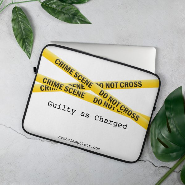 Laptop cover with yellow crime scene tape and text Guilty as Charged