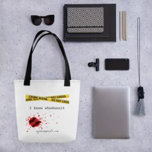 Image shows tote bag with black strap and yellow crime scene tape with the words I Know Whodunnit underneath and blood spatter