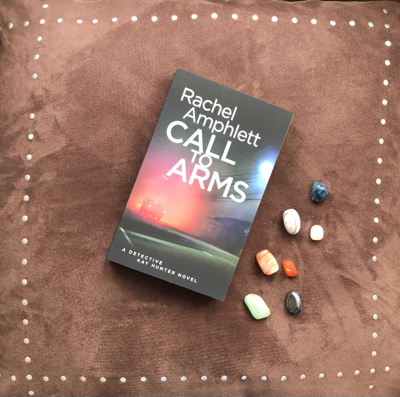 Call to Arms book resting on a brown velvet background