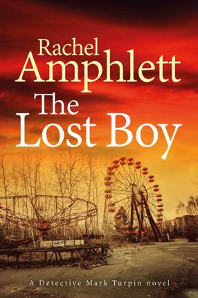 Image shows the cover for The Lost Boy with abandoned fairground rides against an orange and yellow sky