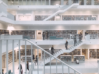 People browsing books in a library 330x248